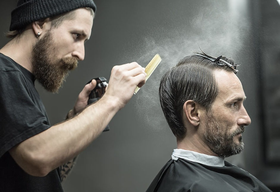Barber Cutting the Hairs of a Man